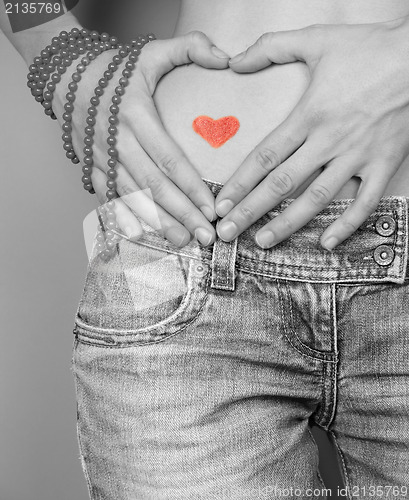 Image of Woman making heart shape