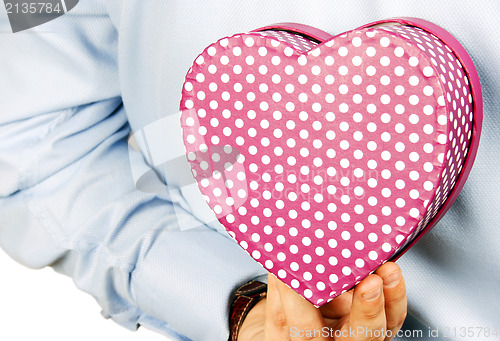 Image of Businessman hiding a gift