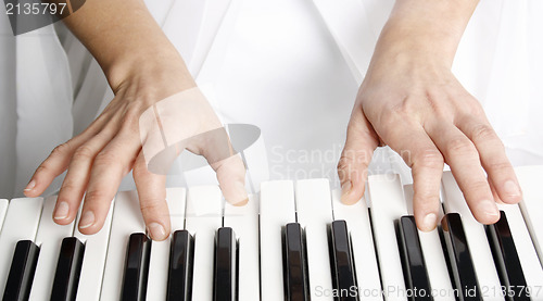 Image of Woman playing piano