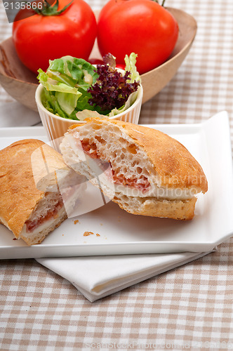 Image of ciabatta panini sandwich with parma ham and tomato