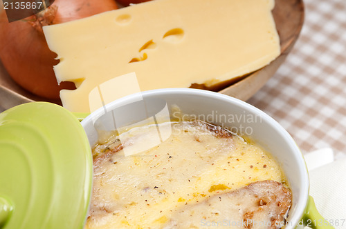 Image of oinion soup with melted cheese and bread on top