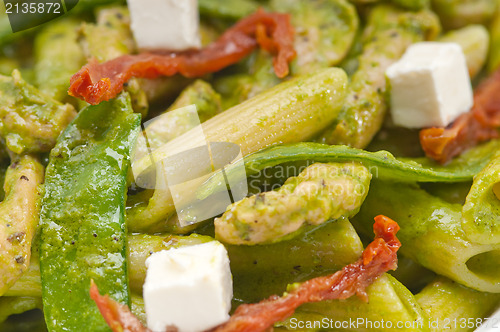 Image of Italian penne pasta with sundried tomato and basil