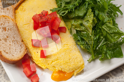 Image of cheese ometette with tomato and salad