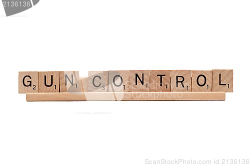 Image of Gun Control scrabble word isolated on white.