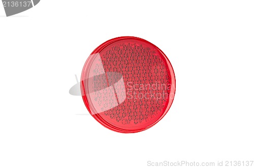 Image of Round red reflector isolated on white.