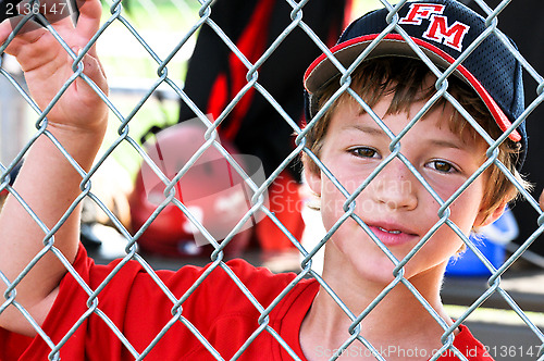 Image of Youth baseball player in dugout