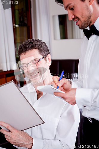 Image of man and woman in restaurant for dinner