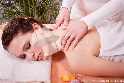 Image of young attractive smilig woman doing wellness spa