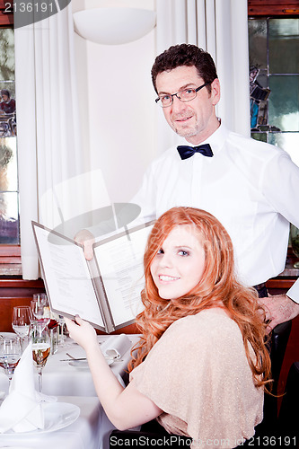 Image of man and woman in restaurant for dinner