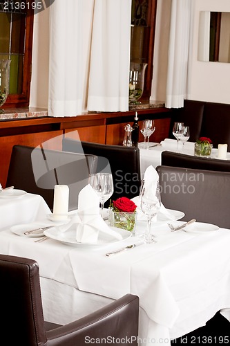 Image of tables in restaurant decoration tableware empty dishware