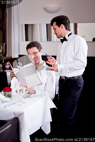 Image of man and woman in restaurant for dinner