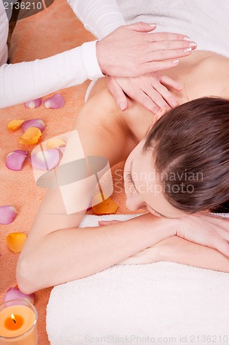 Image of young attractive smilig woman doing wellness spa
