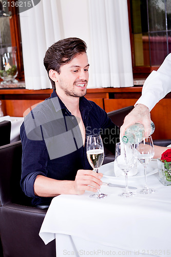 Image of man and woman for dinner in restaurant