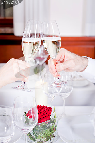 Image of happy smiling couple in restaurant celebrate