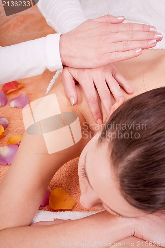 Image of young attractive smilig woman doing wellness spa