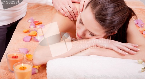 Image of young attractive smilig woman doing wellness spa