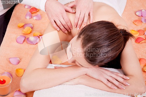 Image of young attractive smilig woman doing wellness spa