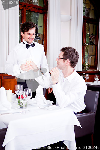 Image of happy smiling couple in restaurant