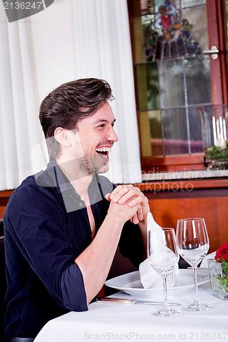 Image of happy smiling couple in restaurant