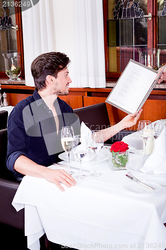 Image of man and woman in restaurant for dinner