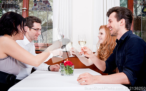 Image of smiling happy people in restaurant