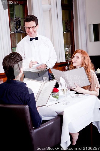 Image of man and woman in restaurant for dinner