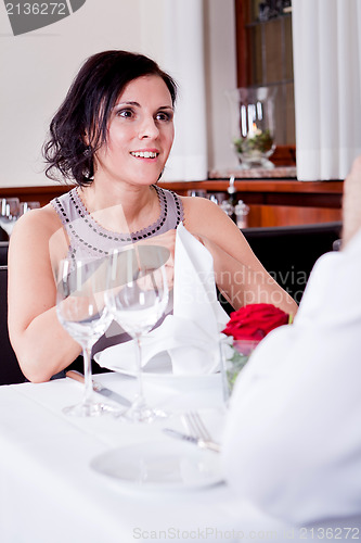 Image of happy smiling couple in restaurant