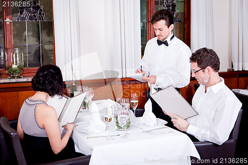 Image of man and woman in restaurant for dinner