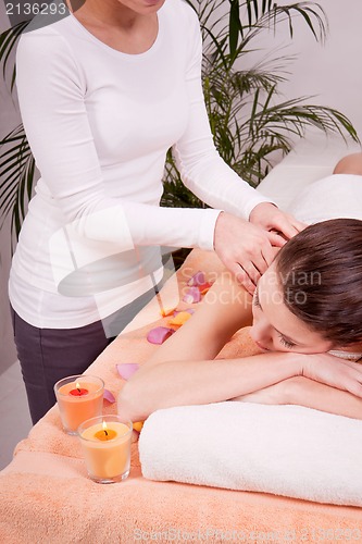Image of young attractive smilig woman doing wellness spa