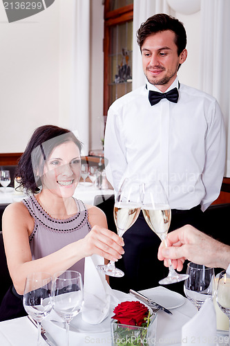Image of happy smiling couple in restaurant celebrate