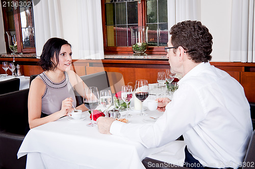 Image of happy smiling couple in restaurant
