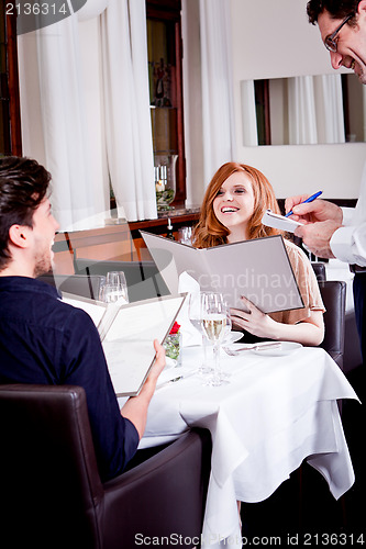 Image of man and woman in restaurant for dinner