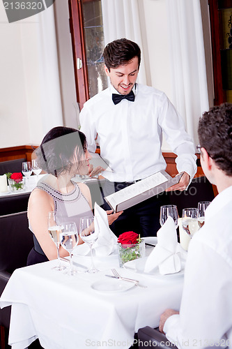 Image of man and woman in restaurant for dinner