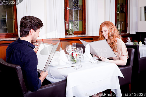 Image of man and woman in restaurant for dinner