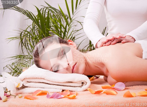 Image of young attractive smilig woman doing wellness spa