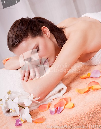 Image of young attractive smilig woman doing wellness spa