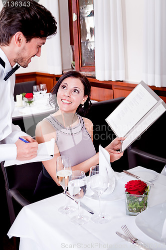 Image of man and woman in restaurant for dinner