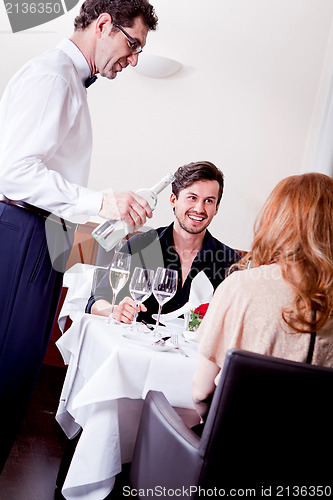 Image of man and woman for dinner in restaurant