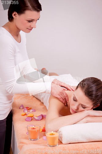 Image of young attractive smilig woman doing wellness spa