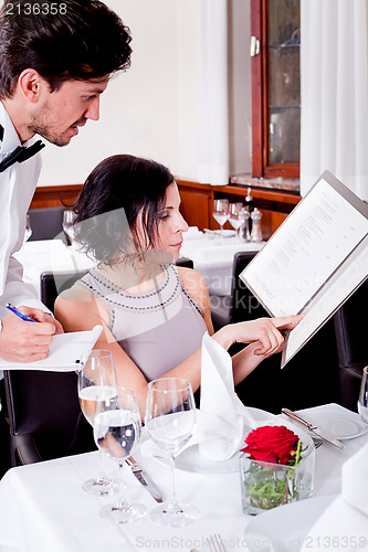 Image of man and woman in restaurant for dinner