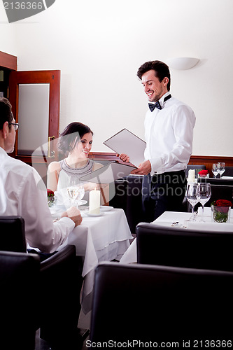 Image of man and woman in restaurant for dinner