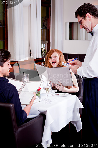 Image of man and woman in restaurant for dinner