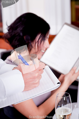 Image of man and woman in restaurant for dinner