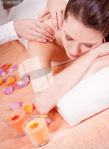 Image of young attractive smilig woman doing wellness spa