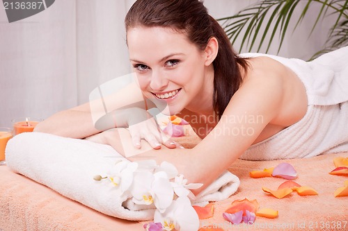 Image of young attractive smilig woman doing wellness spa