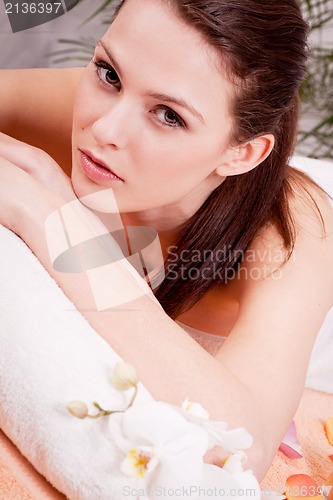 Image of young attractive smilig woman doing wellness spa