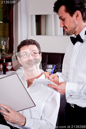 Image of man and woman in restaurant for dinner