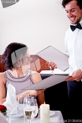 Image of man and woman in restaurant for dinner