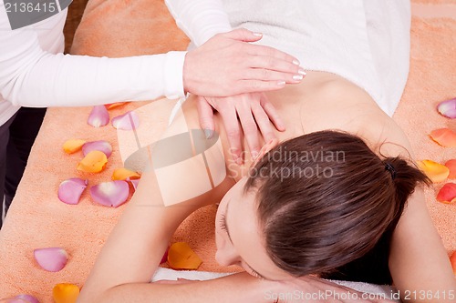 Image of young attractive smilig woman doing wellness spa