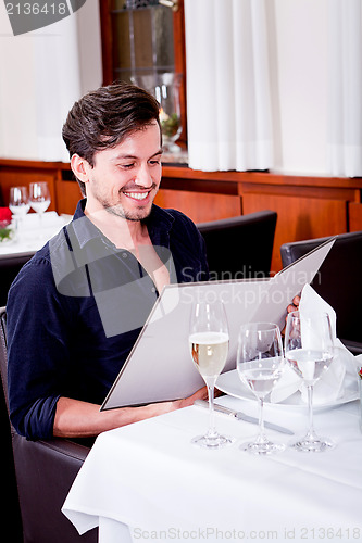 Image of man and woman in restaurant for dinner